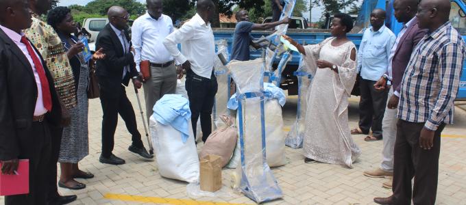Kiryandongo district Members of Parliament handing over assorted Medical Equipment to the District Chairman